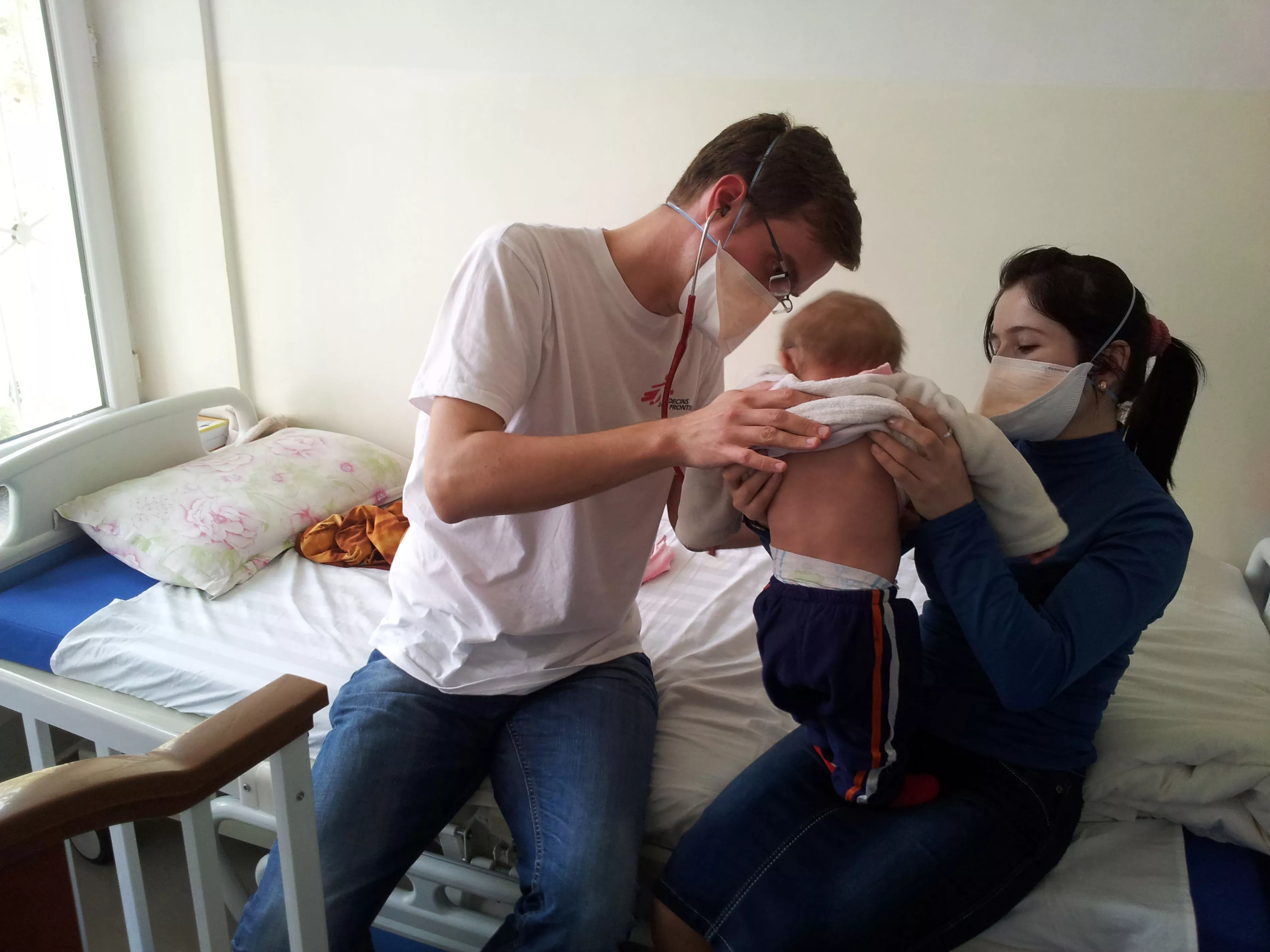 MSF Dr. Christoph Hoehn and nurse Gulru Nobodieva examine a nine-month old baby in Dushanbe, Tajikistan.
