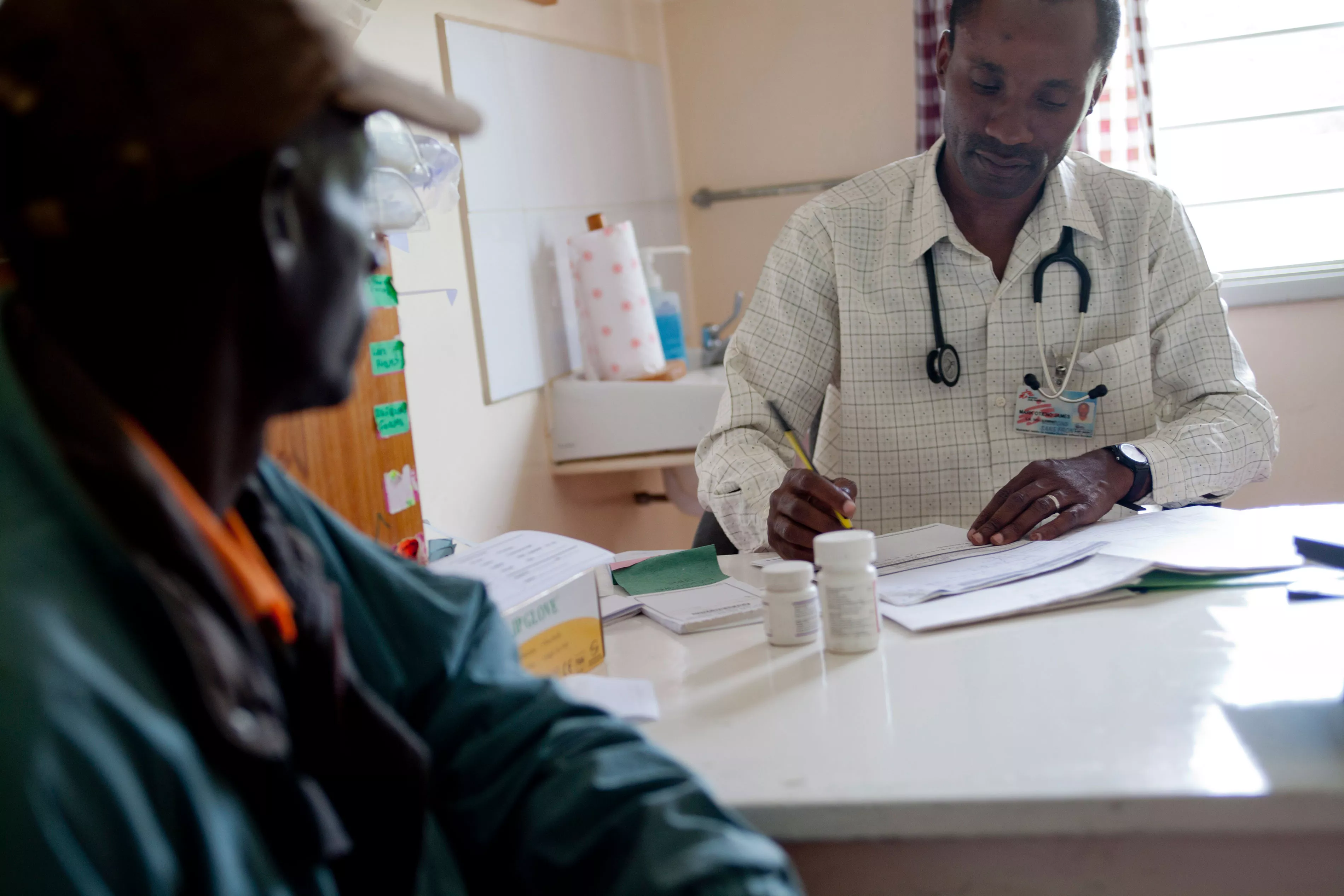 MSF treats more than 200,000 people worldwide for HIV and 97 percent of the antiretrovirals are quality, affordable generics from India. Here, an MSF doctor in Kenya consults one MSF’s thousands of HIV+ patients under treatment. 
