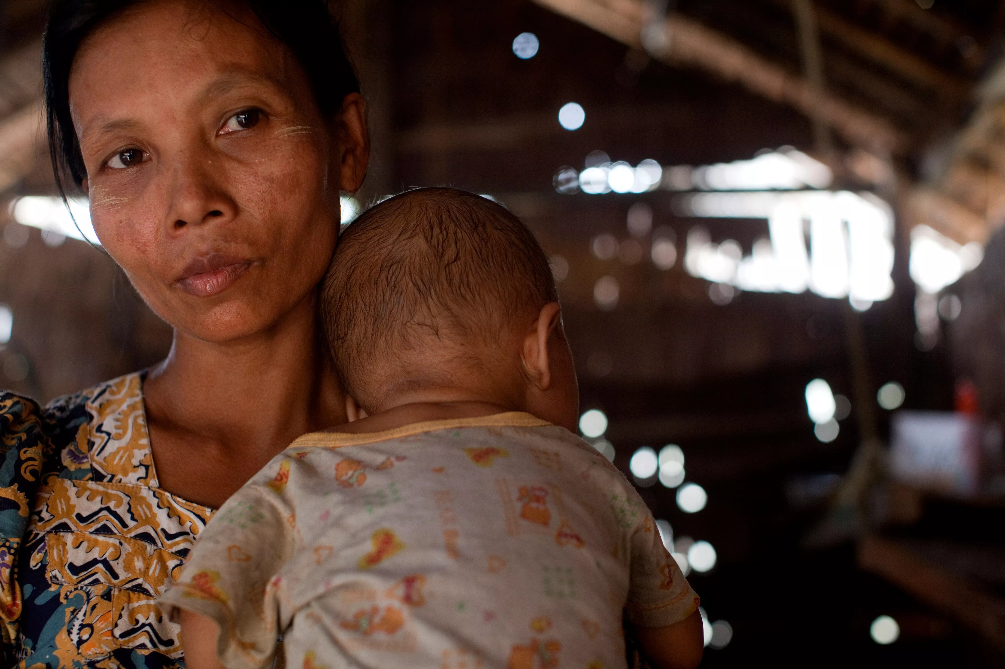 Ma Htwe Myint, 38, holds her 16 month old baby Thar Nge. He is co-infected with HIV and TB.