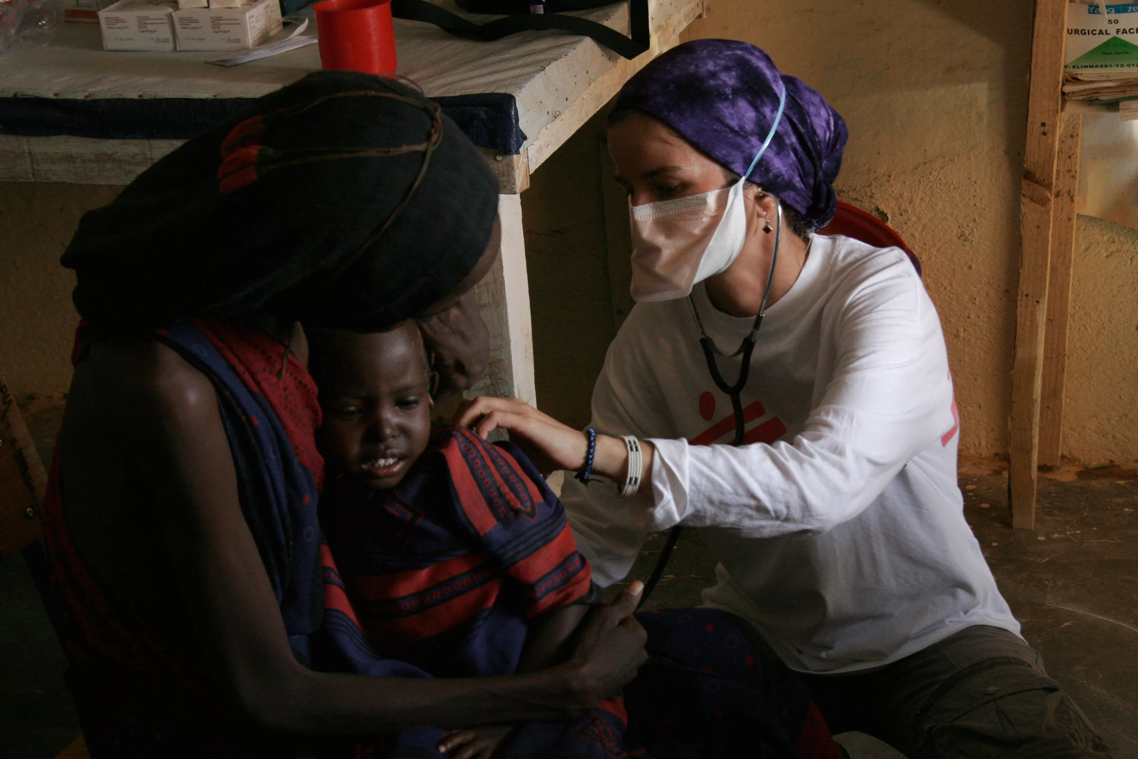 Doctor Sylke Neumann is examining a tuberculosis patient in the TB ward of MSF's health centre in Huddur.
