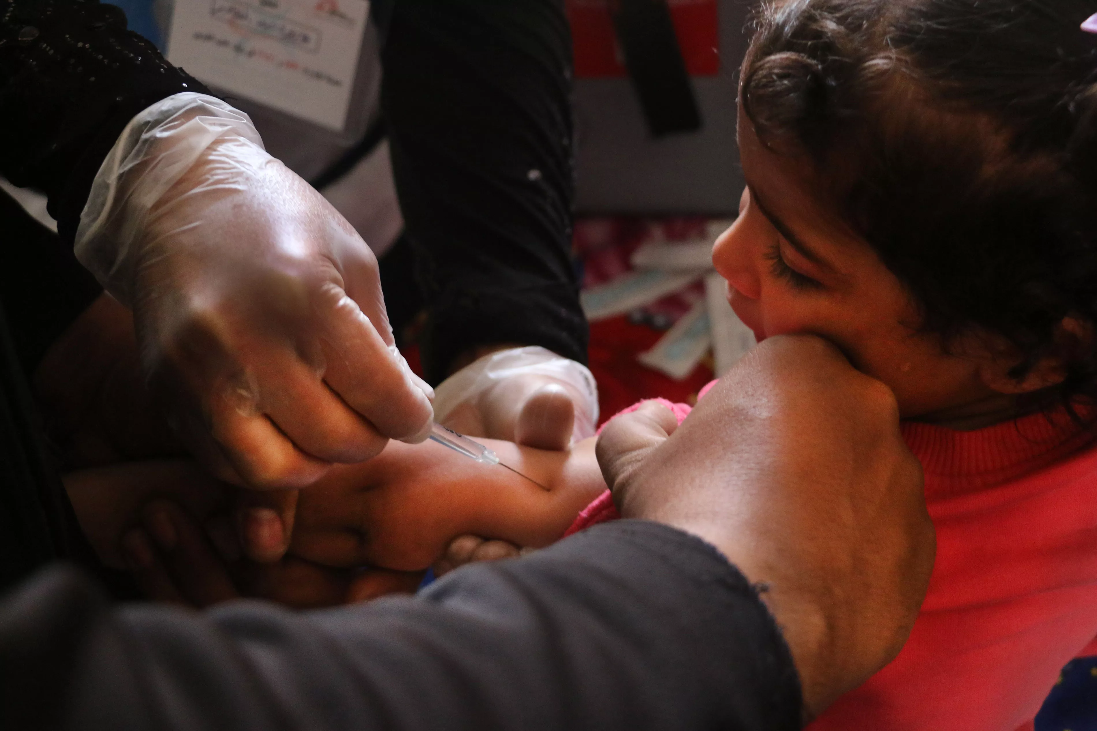 A nurse vaccinates a young Syrian girl against measles and pneumonia in Al-Atareb, Syria. MSF conducted a vaccination campaign targeting tens of thousands of children in partnership with the Syrian Immunization Group and Health Directorate of Aleppo, Syria. -Al-Atareb-14-4-2018 Roaa Hasan.