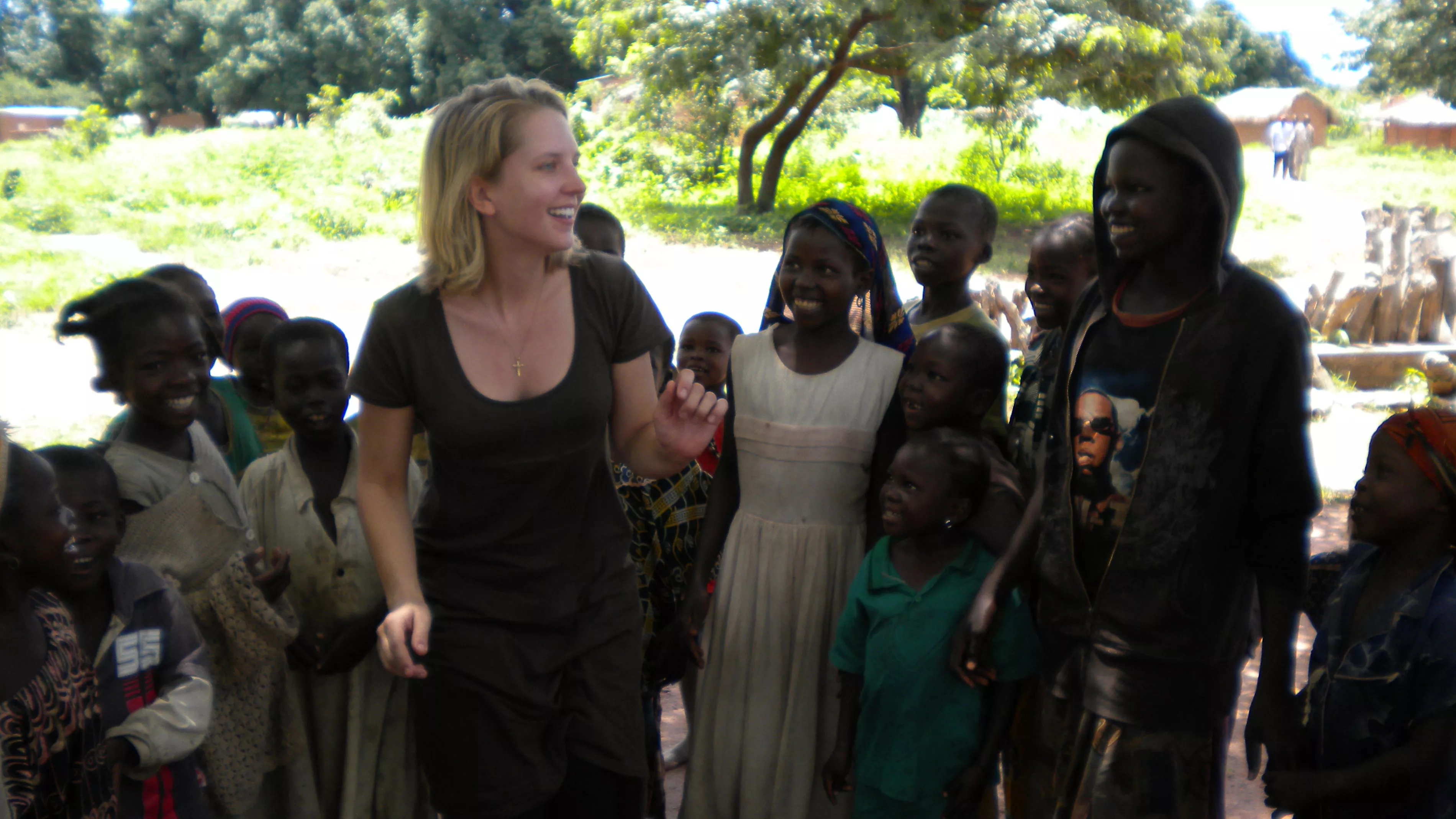 MSF nurse Kathryn Sisterman teaches children in Maitikoulou a song about sleeping sickness in their native language, Mbai.