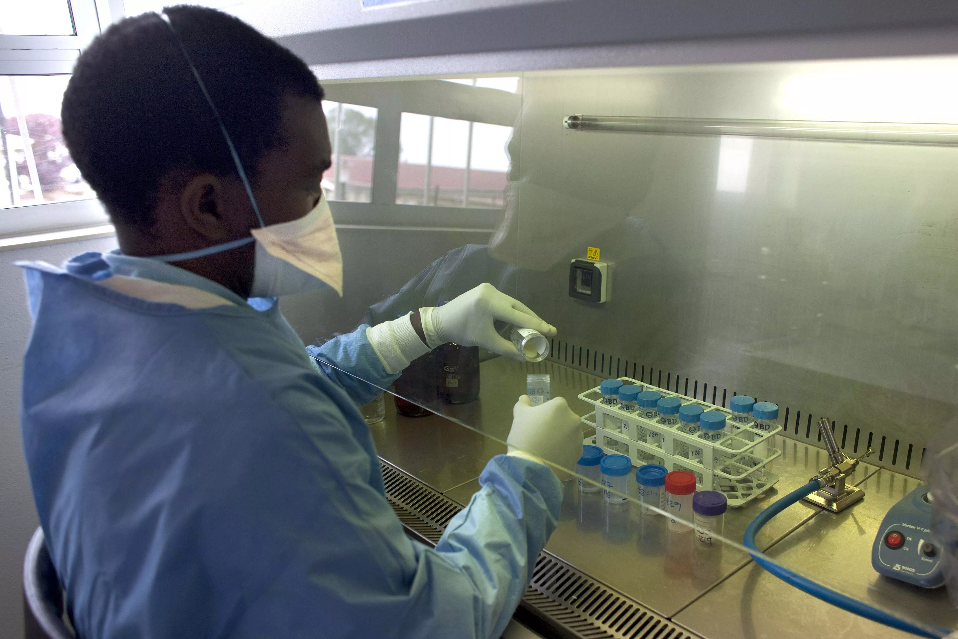 MSF lab technician working in the lab at the Nhlangano TB ward in Shiselweni, Swaziland. Photograph by Giorgos Moutafis