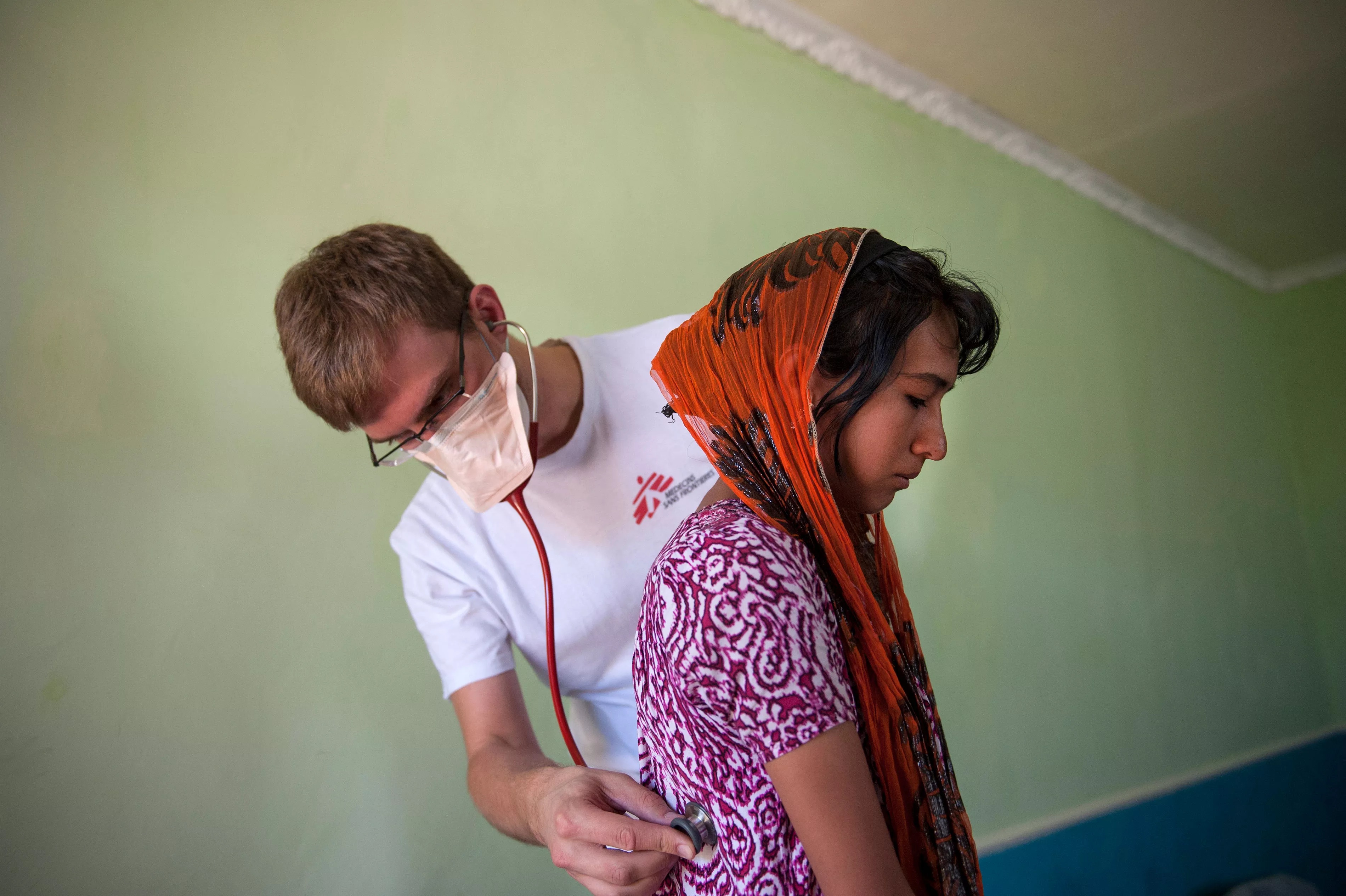 MSF doctor Christoph Höhn examines 16 year-old-Shahnoza in her family home. Shahnoza started MDR-TB treatment in October 2012 but was later diagnosed with XDR-TB. Since January 2013, she is on the right drug regimen, but she will need another 1,5 years of treatment.