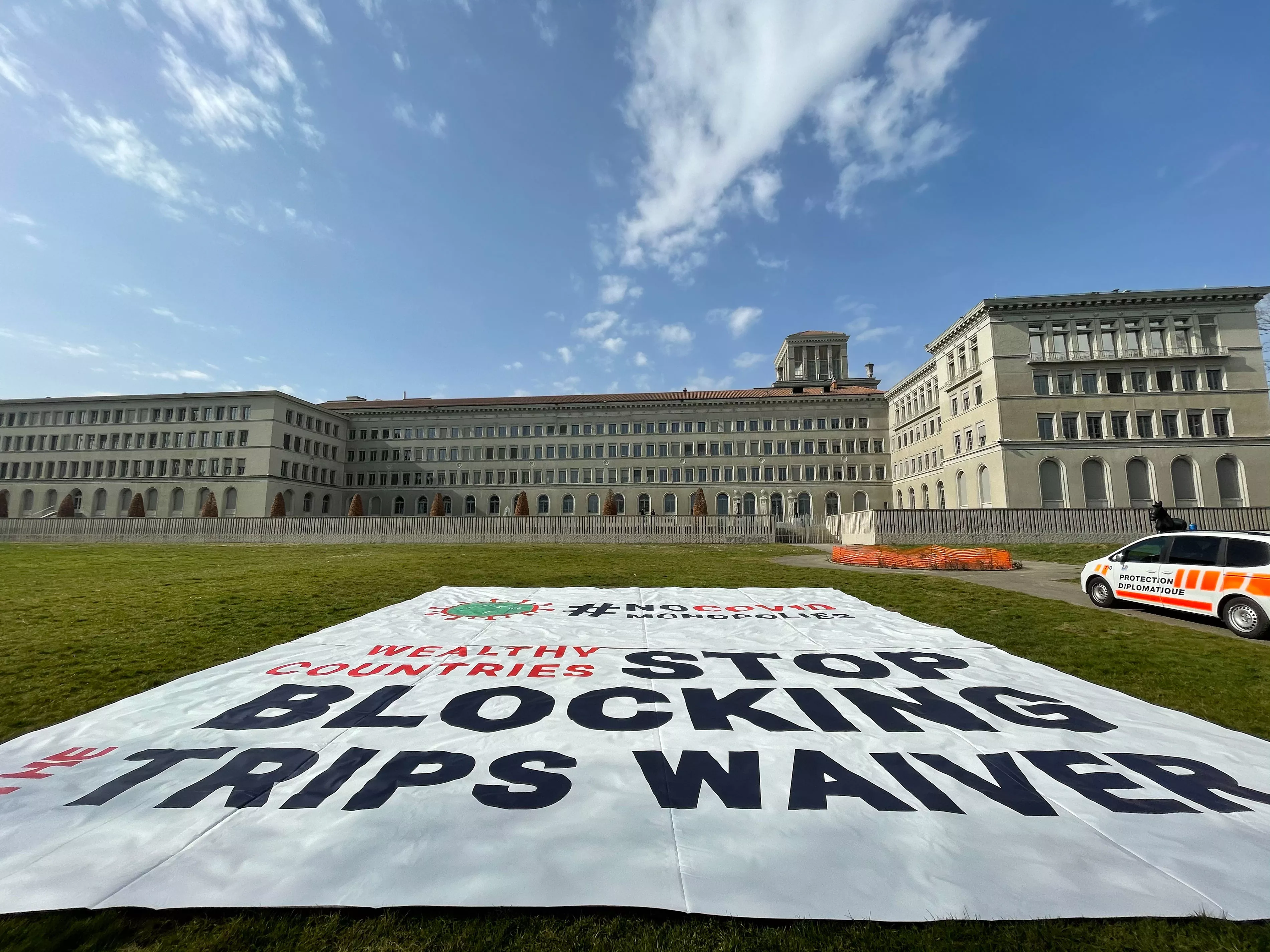View of the banner deployed by MSF in front of the World Trade Organization (WTO) in Geneva calling on certain governments to stop blocking the landmark waiver proposal on intellectual property (IP) during the pandemic.