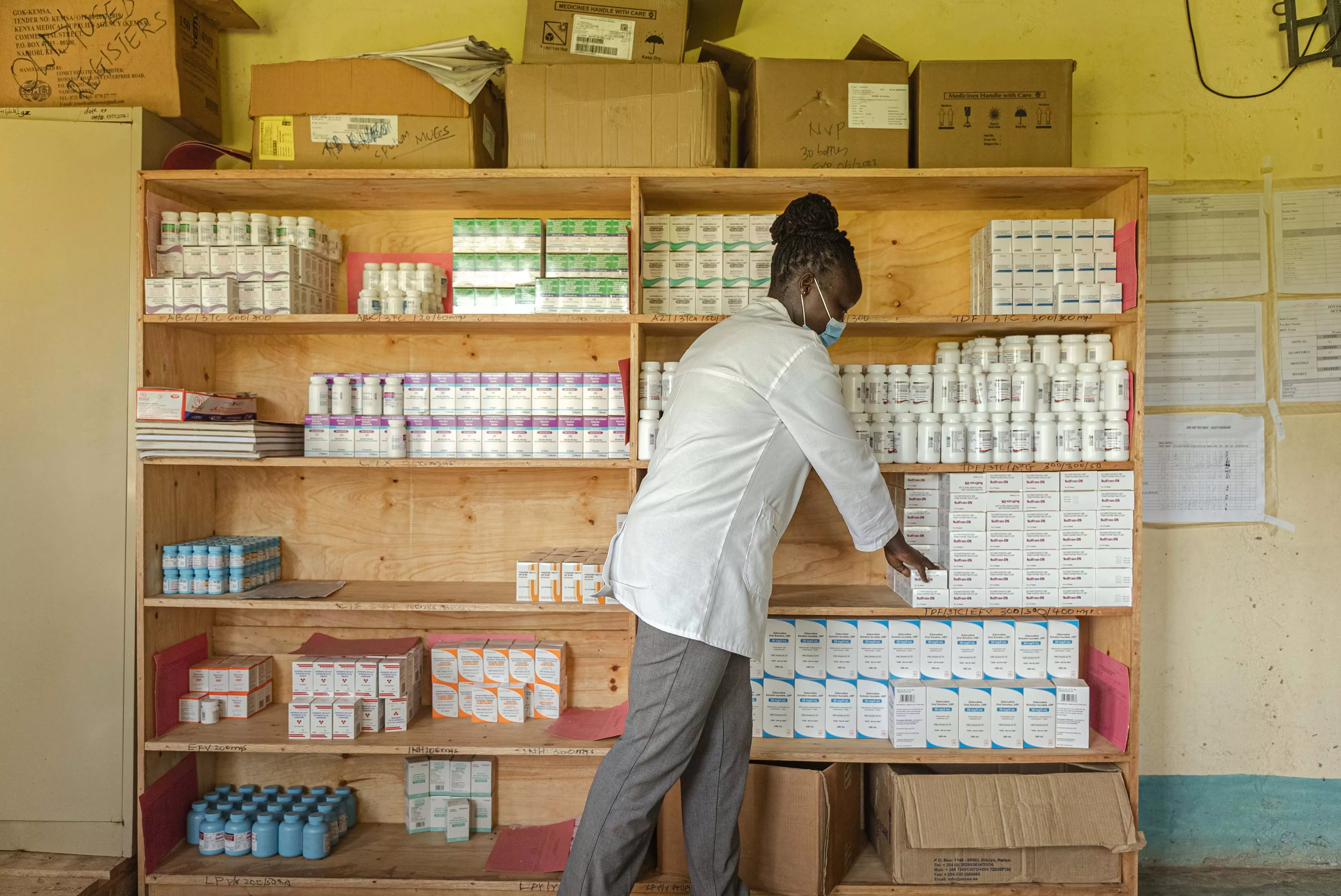 A clinician gathering antiretroviral medications for a patient at Maram Dispensary in Ndhiwa sub county, Homa Bay County, Kenya, 2021