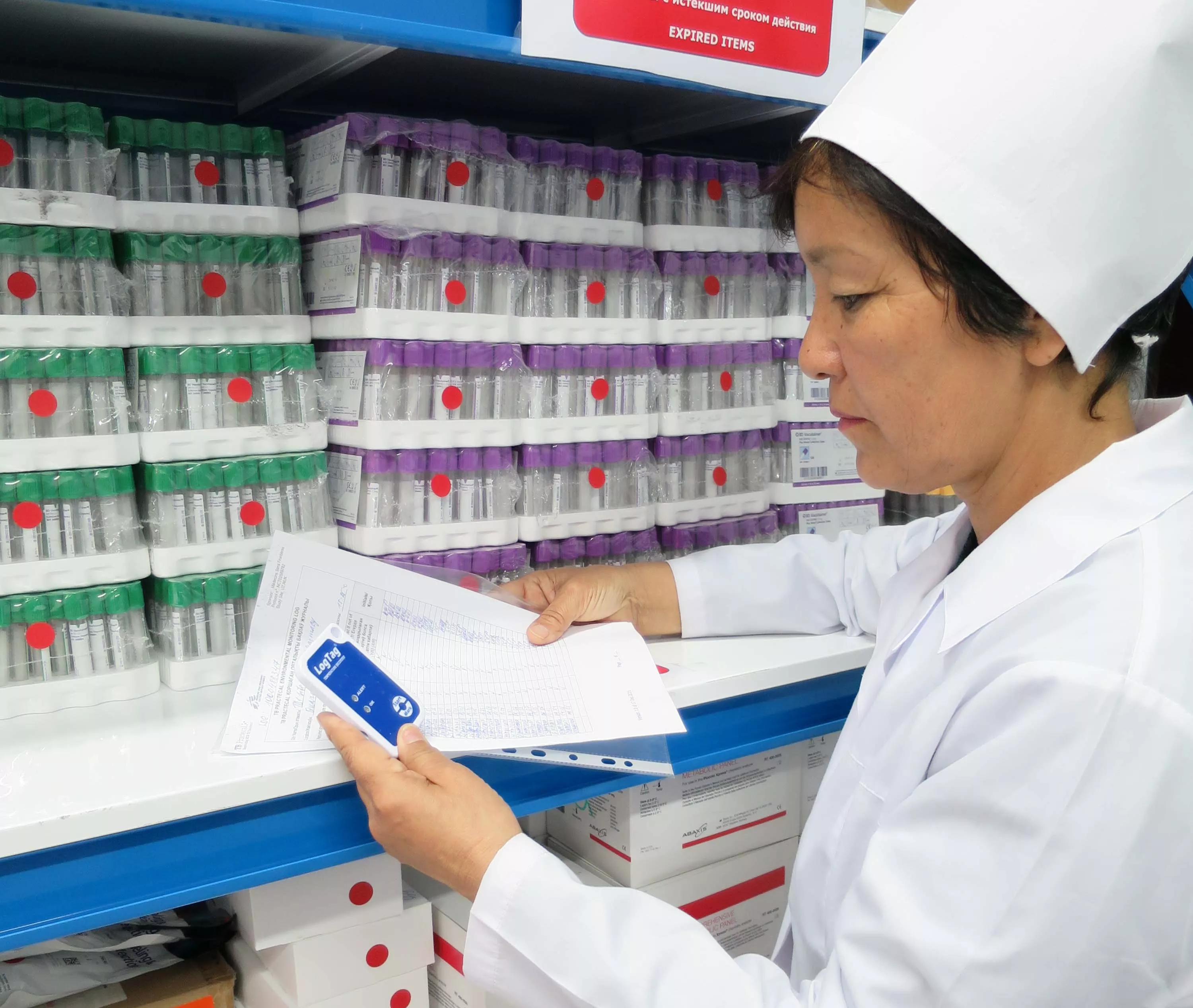 A Nurse examines medications in the storeroom at the TB Practecal Warehouse in Nukus, Uzbekistan.