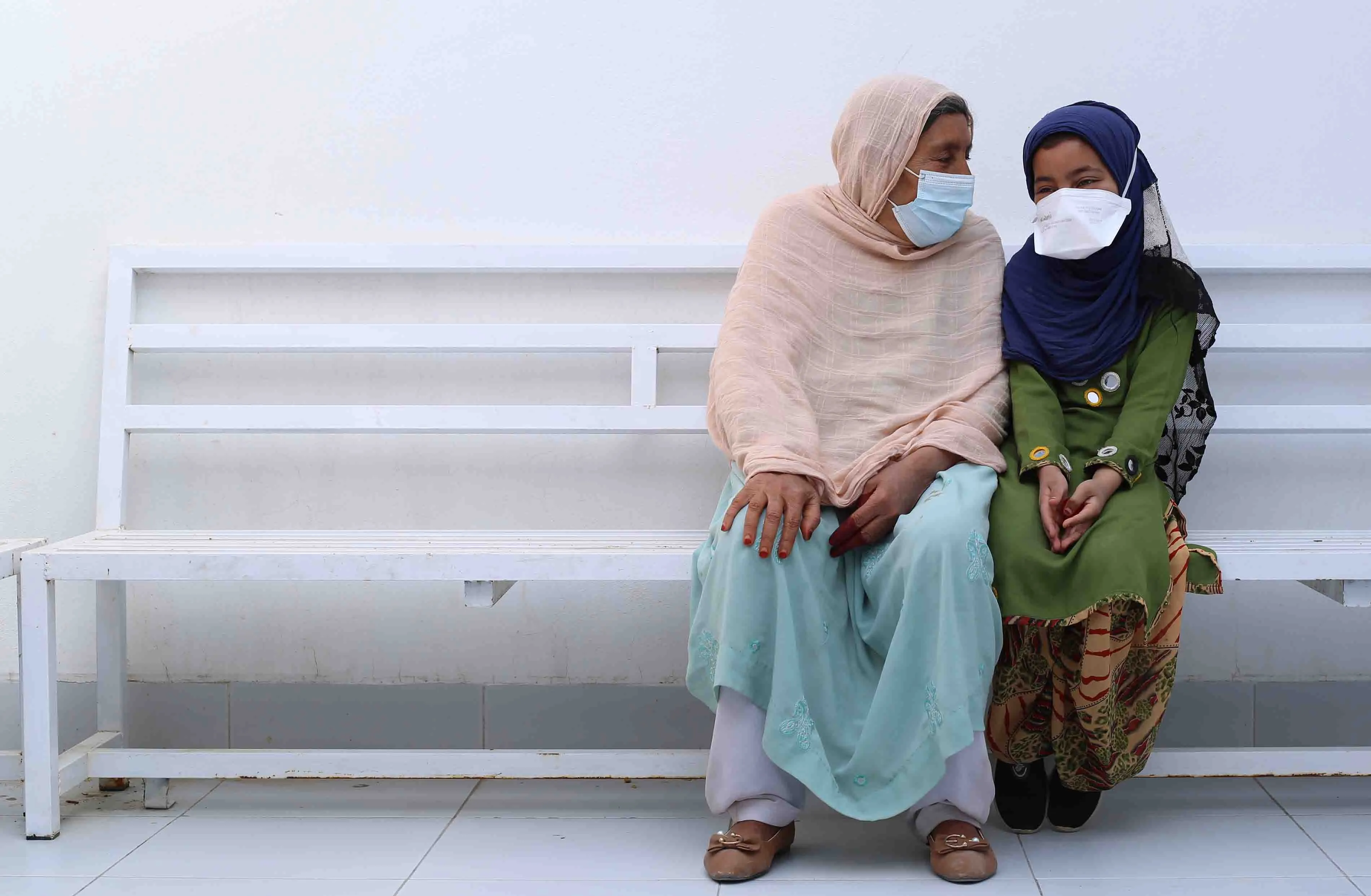 Bibi Amina and her granddaughter Sayeeda wait to see a doctor at MSF's DR-TB hospital in Kandahar, Afghanistan, September 2022