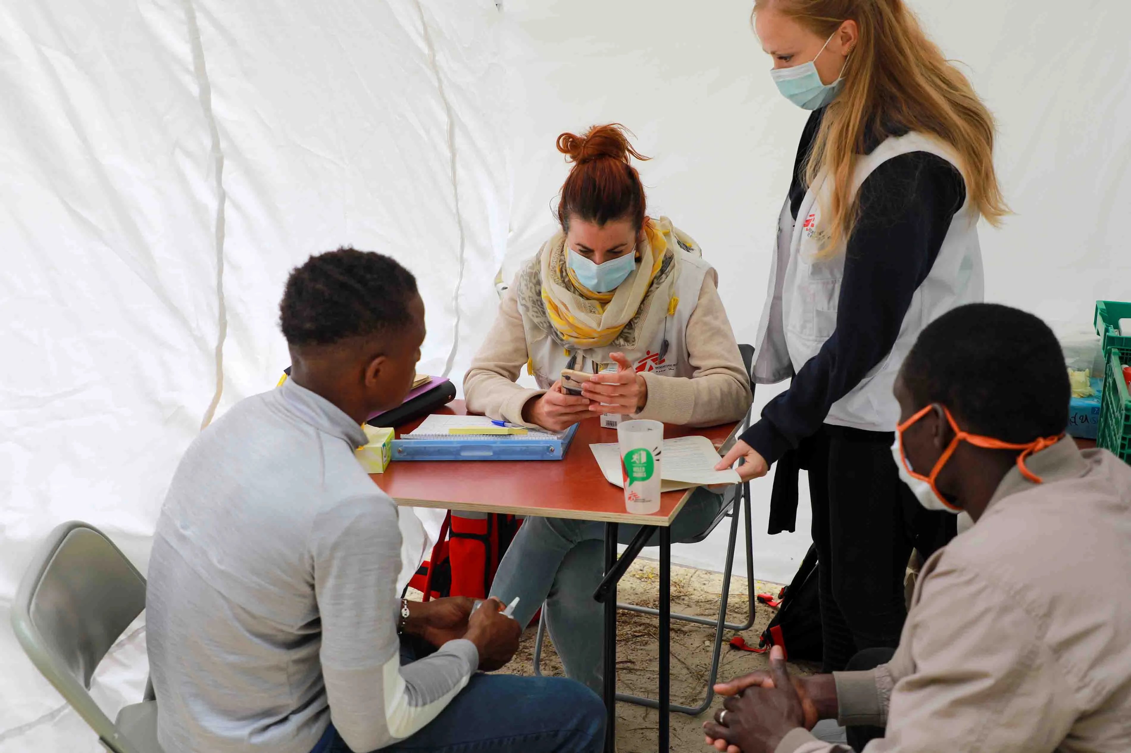 MSF nurses giving free consultations to unaccompanied foreign minors in the Paris camp. 2020.
