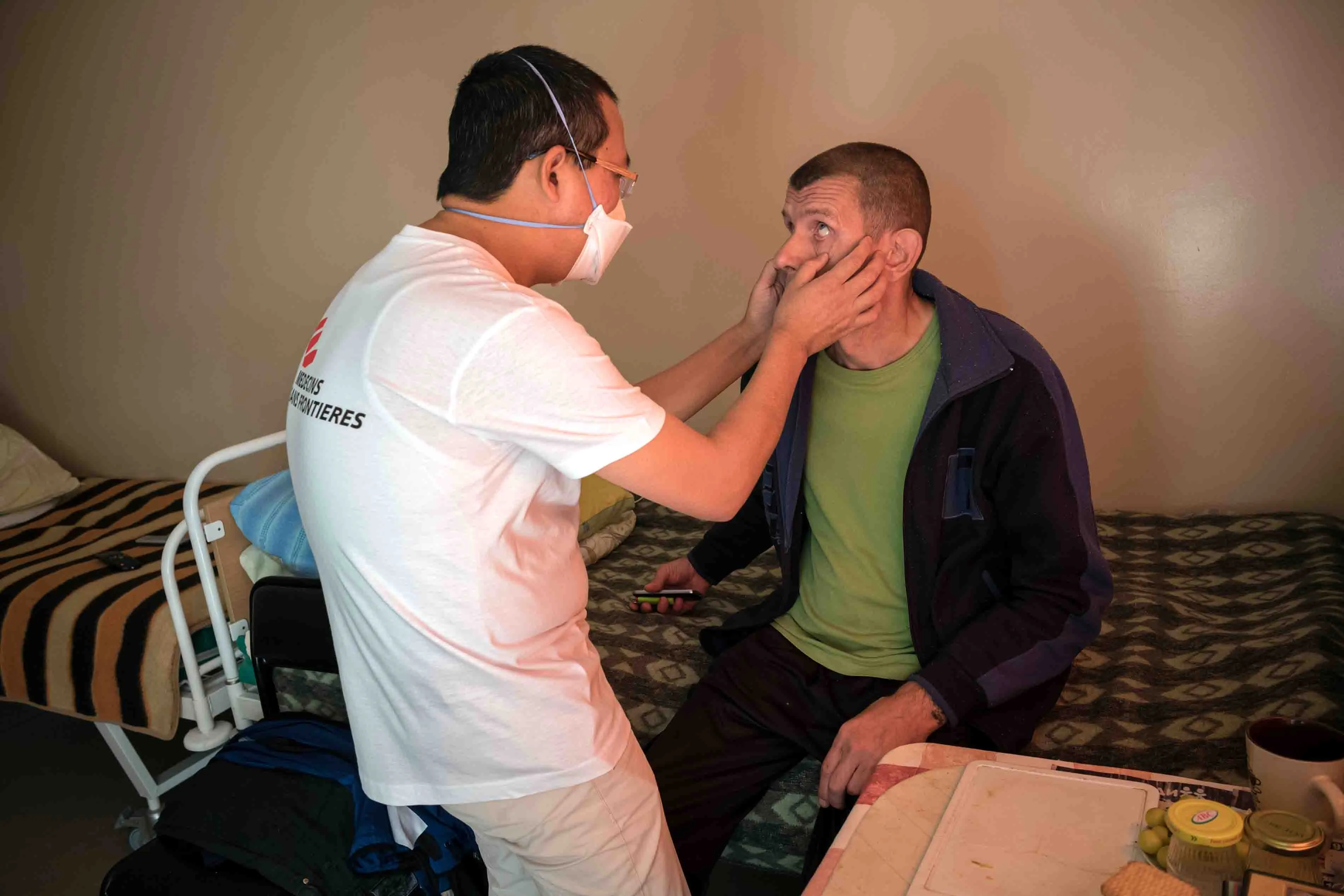 MSF doctor Begimkul examining Dmitry, a person living with TB, TB Institute, Minsk, Belarus, 2018