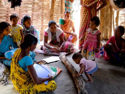 A Medecins Sans Frontieres (MSF) health promoter holds a health education information session for mothers in Aragata village, Chhattisgarh, India.