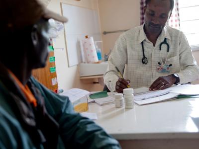 MSF treats more than 200,000 people worldwide for HIV and 97 percent of the antiretrovirals are quality, affordable generics from India. Here, an MSF doctor in Kenya consults one MSF’s thousands of HIV+ patients under treatment. 