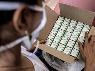 Nischaya, an XDR-TB patient, looking at her TB medication at the MSF clinic in Mumbai. Photograph by Atul Loke 