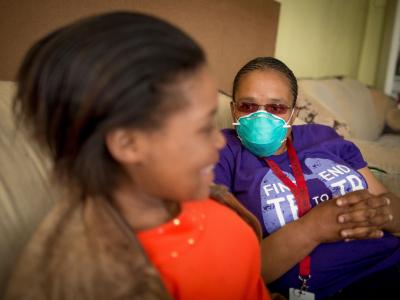   Sinethemba, 16 years,her MSF counsellor, Xoliswa, at her home in Khayelitsha, Western Cape, South Africa, where she lives with her grandmother, Vuyisiwa Madubela, and four other familtb_southafrica_sinethembawithcounselor_msf177617_sydellwillowsmith.jpg