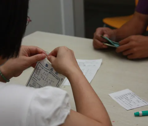 An MSF national doctor consults with an HIV patient in the MSF/CDC clinic in Nanning, Guangxi Province, southwest China in July 2010