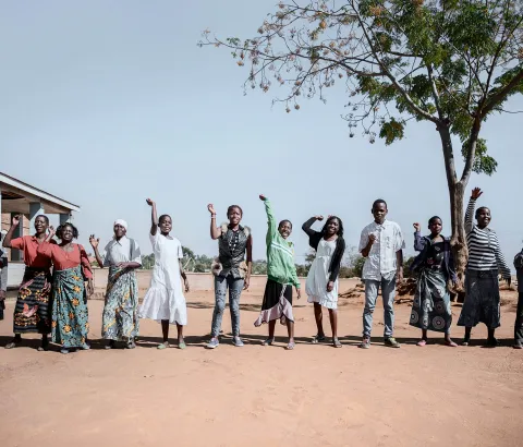 Patients and MSF staff perform a dance to welcome new members to the "six-months-meeting day" in Mbulumbuzi Health Centre for the Adolescent HIV project in Malawi, it also monitors all the girls and boy who have already joined the program.