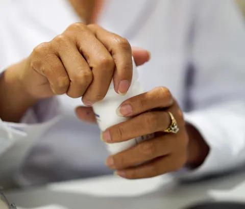 MSF Pharmacy Technician Toueng Sreymon distributes Hepatitis C meds at the MSF Hepatitis C clinic at Preah Kossamak Hospital in Phnom Penh, Cambodia, 18, April 2017. Photograph by Todd Brown