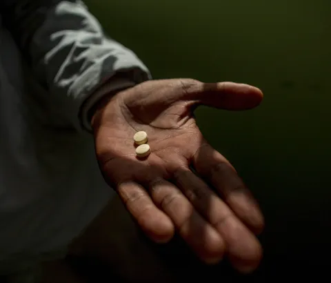 Simphiwe holds his first delamanid tablets, which have now been included into his treatment regimen for XDR-TB, October 2016.