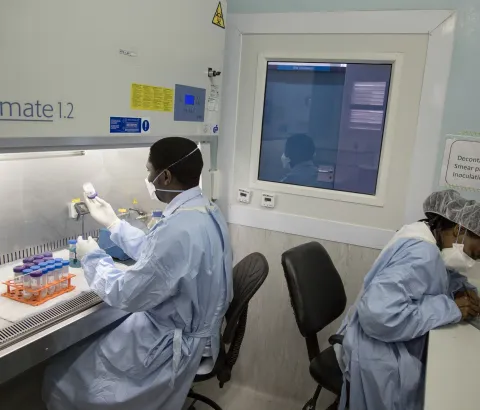 Lab technologists preparing sputum samples to realize bacteria cultures. Kwanele Dlamini (left), MSF Lab Technologist, & Nobuhle Matsabula (right), MoH Microscopist. National TB Reference Laboratory, Government Hospital, Mbabane, Swaziland.
