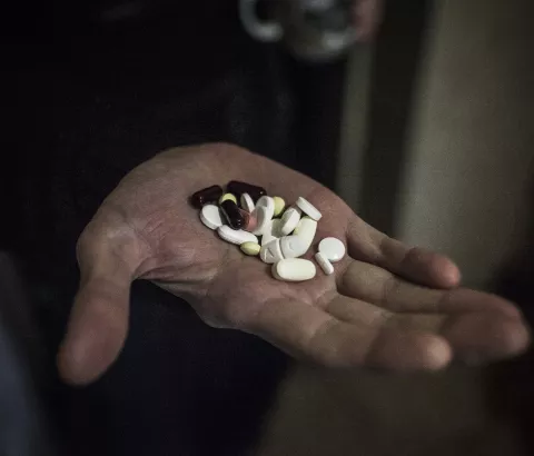 A patient with TB shows the pills for his treatment in a prison in Donetsk, Ukraine, where MSF is helping to treat patients infected with TB. MSF has been running a TB treatment program within the penitentiary system in Donetsk since 2011.