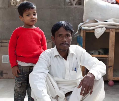 Noor Alam (pictured here with his son) was cured of Hepatitis C at MSF's Machar Clinic in Pakistan in 2016 after recieving a generic version of sofosbuvir. Gilead has priced sofosbuvir at $1,000 per pill in the U.S., despite the fact that manufacturers in India say they could produce this drug for as little as about $1 per pill.