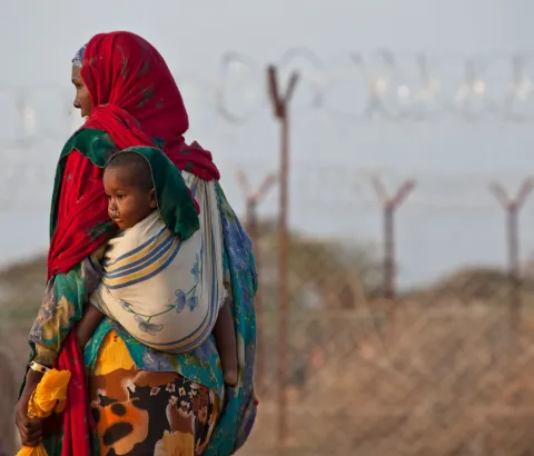 Somali refugees who have just arrived at Dadaab refugee camp wait at a reception area in the first days after arriving. The emergency situation has created a backlog for the registration process, which is key for refugees to get a regular, predictable and adequate supply of food.