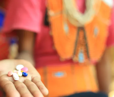 Aphe, care taker of Abino (pseudonym), 20 years old, MDR-TB patient gives her anti-TB medicines. Abino says, “I live in a big family of 10 members. Yet no one cares for me or talks to me, except my sister in law, Aphe. When I could not get up, she brought me food and water. She gives me the medicines on time every day.” 