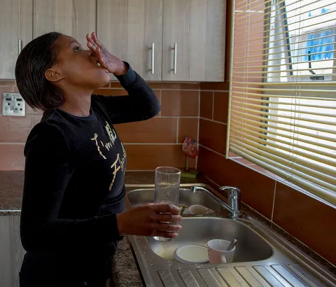 Sinethemba Kuse her daily regimen for XDR-TB at 10am each day. She also takes two additional delamanid tablets at night.