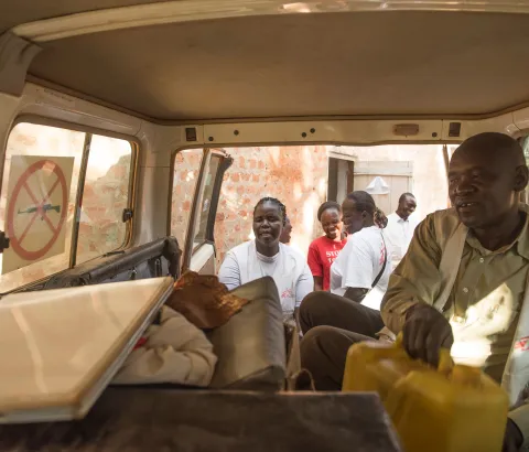 MSF field staff load an MSF car with working materials for the field in Yambio.