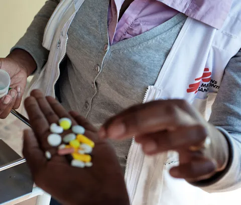Nolitha Tsilana, a MSF nurse, delivers TB pills to a patient at Lizo Nobanda TB Care Centre in Khayelitsha township, Cape Town.