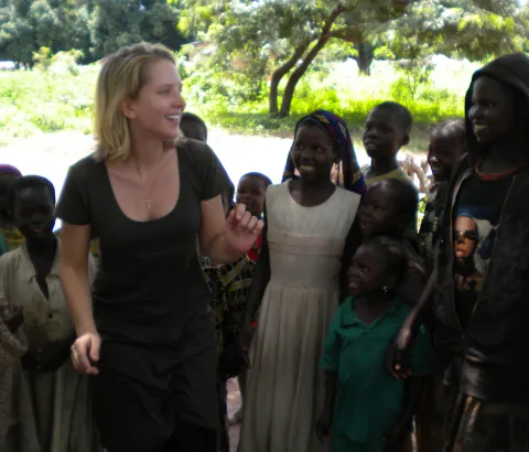 MSF nurse Kathryn Sisterman teaches children in Maitikoulou a song about sleeping sickness in their native language, Mbai.