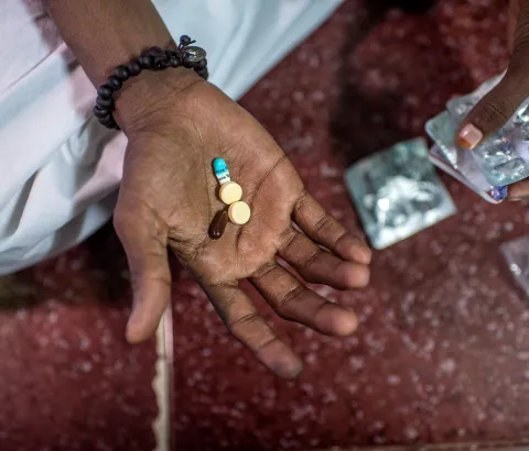 XDR-TB patient Hanif, taking his daily TB medication at home in the Govandi area of Mumbai, 2016.