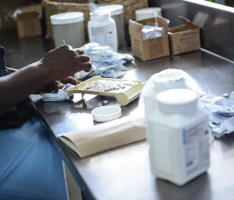 Staff at the Epworth clinic pharmacy preparing medication to be collected by patient. Photograph by Ikram N'gadi