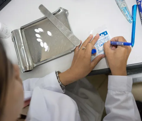 MSF Pharmacy Technician Toueng Sreymon distributes Hepatitis C meds at the MSF Hepatitis C clinic at Preah Kossamak Hospital in Phnom Penh, Cambodia, 18, April 2017. Photograph by Todd Brown