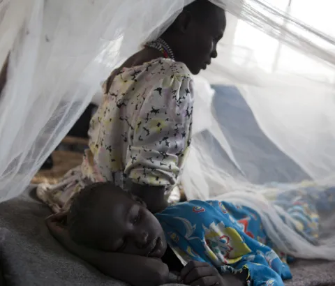 Banuna is in the MSF hospital in Doro with her mother Arabiya. Banuna just woke up from a five day coma, due to Malaria. The doctors did not think she was going to make it, her waking up is a small miracle. Her mother Arabiya says she was afraid of seeing her like that, she says "it was like she was dead". Photograph by Olga Victoire