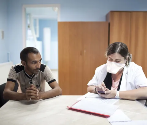 Medical staff work in the ambulatory ward at the National Centre for Tuberculosis and Lung Disease in Georgia’s capital, Tbilisi. Patient Goderdzi Rajabishvili (left) recovers from his morning infusion of imipenem, an antibiotic drug used for the treatment of MDR-TB. Photograph by Daro Sulakauri