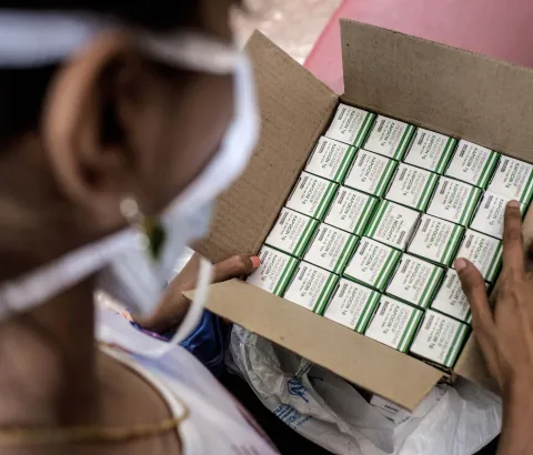 Nischaya, an XDR-TB patient, looking at her TB medication at the MSF clinic in Mumbai. Photograph by Atul Loke 