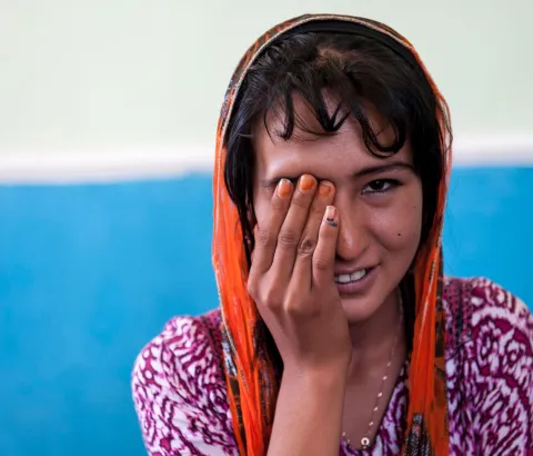 MSF doctor Christoph Höhn performs an eye test on 16-year-old patient Shahnoza in her family home. Shahnoza started MDR-TB treatment in October 2012 but was later diagnosed with XDR-TB. Since January 2013, she is on the right drug regimen, but she will ne