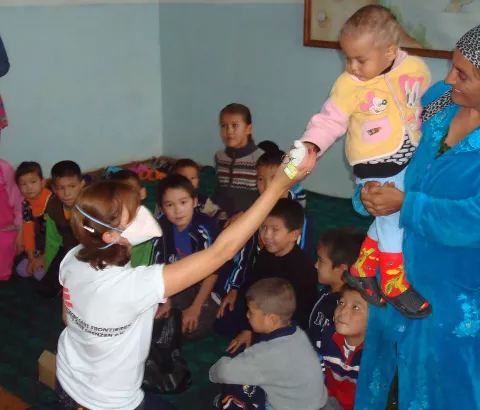 Medical Team Leader Tatyana Pylypenko and staff members distribute toys donated to MSF in a TB children’s ward in Nukus, Uzbekistan. Photograph by Rolan Abipov