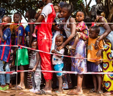 Children queue at a vaccination point in the commune of Matoto, Conakry, Guinea. Médecins Sans Frontières/Doctors without Borders (MSF) is launching a large scale measles vaccination campaign in Conakry, the capital of Guina. Since the beginning of the year there have been 3468 confirmed cases and 14 deaths dues to measles in Guinea. Conakry and Nzérékoré are the most affected districts. Photograph by Markel Redondo