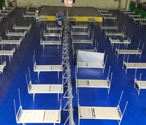 An after view of the indoor stadium at Patliputra Sports Complex.  The teams are working to set up a 100-bed COVID-19 treatment facility in the indoor stadium of Patliputra Sports Complex, Patna with the purpose of treating cases of COVID-19.  The intervention aims to reduce the morbidity and mortality associated with the COVID-19 outbreak in Patna.  This facility will help in decongesting the government hospitals to allow more effective resource management of severe cases of COVID-19.