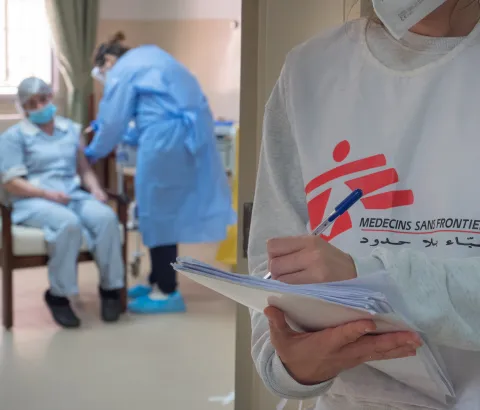 A Front Line Health Worker at an Elderly Nursing Home receives her COVID-19 vaccine