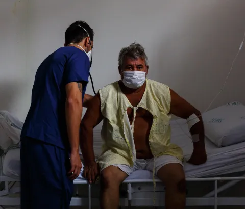 A medic attends to COVID-19 patient Antônio da Consolação Pinho in Ji-Paraná's Municipal Hospital, in Rondônia state, Brazil.