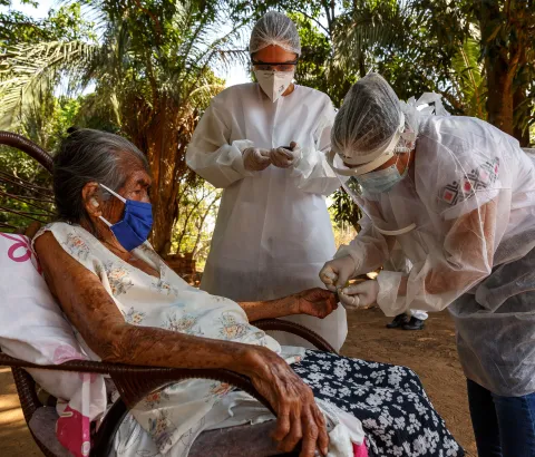 Nurse Mayra Leandro works with the health worker of the Special Indigenous Health District of Mato Grosso do Sul (DSEI MS) who attends patients at Lagoinha village. The sugar level of her blood is tested, as many indigenous people suffer from diabetes. 