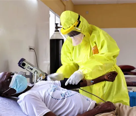 Doctor Banza Ilunga, clinical doctor at the COVID19 Treatment Center (CTCO) housed by the Referral Kinkole Hospital (HGR), takes care of hospitalized patients in this establishment on the downtown of Kinshasa, the capital of the Democratic Republic of the Congo (DRC).