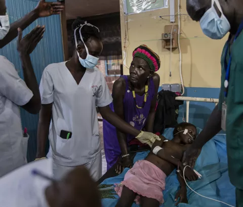 Atong Dut Deng, 8 years old, infected with cerebral malaria. She is being attended to by MSF medical staff in the ICU at MSF supported Aweil State Hospital.