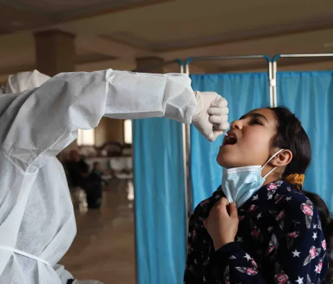 Child receiving a vaccine through an MSF routine vaccination campaign, Wadi Khaled, Akkar, Lebanon, February 2022.