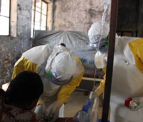 Medical staff providing treatment in MSF-supported Bolomba Ebola treatment center, Equateur province, DRC, August 2020