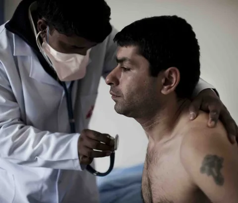 National TB Centre, Abovian, Armenia ¿ February 2010. Dr Shahidul Islam, an MSF TB doctor, examines a patient on the DR TB ward in the national TB centre. Many patients are unable to complete the grueling course of drugs.
