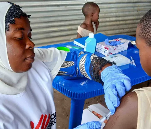 A child receives measles vaccine at the Musenyi refugee site. 8,500 refugee children aged 6 months to 14 years were targeted for the vaccination campaign at the Musenyi site.